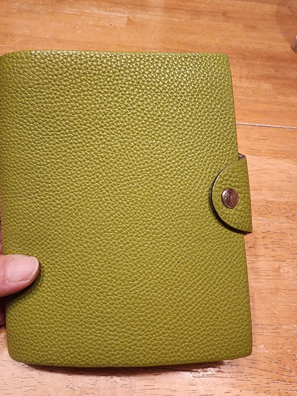 authentic Hermès Ulysse PM notebook cover crafted in green Togo calfskin leather